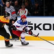 MINSK, BELARUS - MAY 18: Russia's Yevgeni Dadonov #63 skates with the puck while Germany's Justin Krueger #3 chases him down during preliminary round action at the 2014 IIHF Ice Hockey World Championship. (Photo by Andre Ringuette/HHOF-IIHF Images)